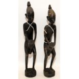 Pair of wooden carved African drummer figures, 31cms tall