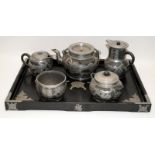 A Chinese Yixing pottery & pewter six piece dragon tea service to include a teapot, two jugs and two