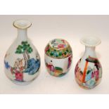 Two Chinese famille rose vases painted & a lidded pot. H11cm.There is a repair to pot lid.
