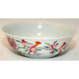 A Chinese Famille rose porcelain shallow bowl painted pomegranates, kangshi circle mark to base,