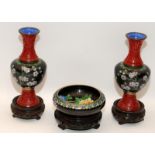 Handed pair of Oriental cloisonné vases with applied cinnabar decoration together a similar bowl all