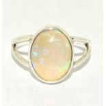 Direct from the Australian Opal miner a set in silver Opal Chrystal ring size N