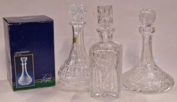 Collection of four various crystal glass decanters one of which being boxed.