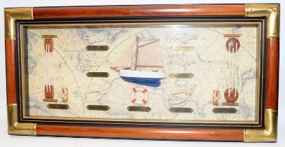 Wood and brass framed and glazed diorama featuring a sailing boat and examples of ship's knots.