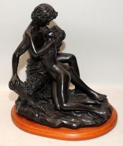 Bronzed resin figure of two lovers. 27cms tall