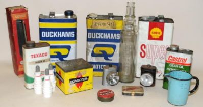 Collection of vintage oil cans and associated products to include an Essolube glass bottle, Shell