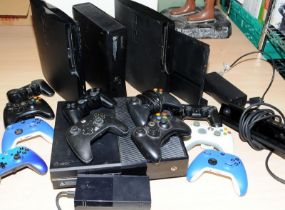 Collection of XBox and Playstation consoles and controllers