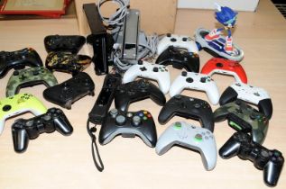 A quantity of games controllers c/w a Wii console