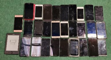 Box of smartphones. Various makes and models.