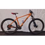An orange bicycle 19" frame size 28" wheel size 20 gears.(24)