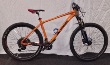 An orange bicycle 19" frame size 28" wheel size 20 gears.(24)