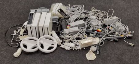 Very large collection of Nintendo Wii related items to include consoles, leads, controlles and