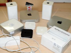 A carton of various Apple products including Mac Mini and Tv's