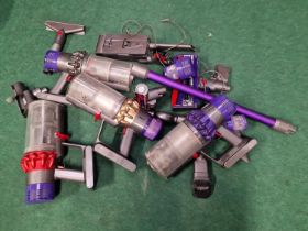 Collection of Dyson cordless vacuum cleaner spares.