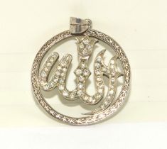 Diamond pendant with embossed edges depicting a possible Arabic serpent approx 1ct diamonds