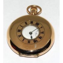 9ct gold side wind half hunter pocket watch set with enamel face and roman numerals with