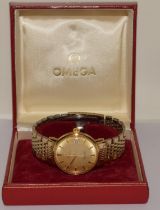 Omega Seamaster De Ville gents automatic dress watch on Omega branded gilt bracelet. Seen working at