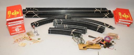 A quantity of OO Gauge track, straights and curves of varying sizes together with boxed left and