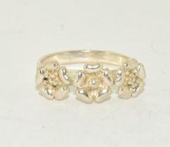 A 925 silver triple flower ring Size R.