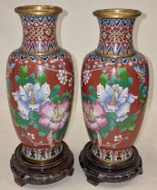 Pair of Cloisonne vases standing on wooden bases 26cm tall