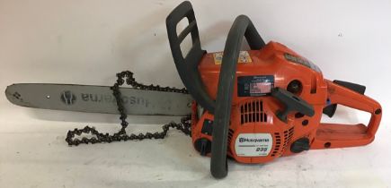 Husqvarna e Series petrol chain saw model No. 235.