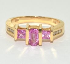 14ct gold ladies Pink Topaz and Diamond shoulder ring size O