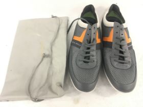 Pair of Hugo Boss Training shoes in grey and orange size 44 complete with bag.