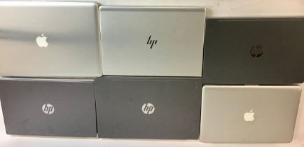 Laptop computers x 6. Makes here are Apple and HP.