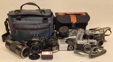 Collection of various cameras to include Olympus Trip 35, Canon T50 and others.