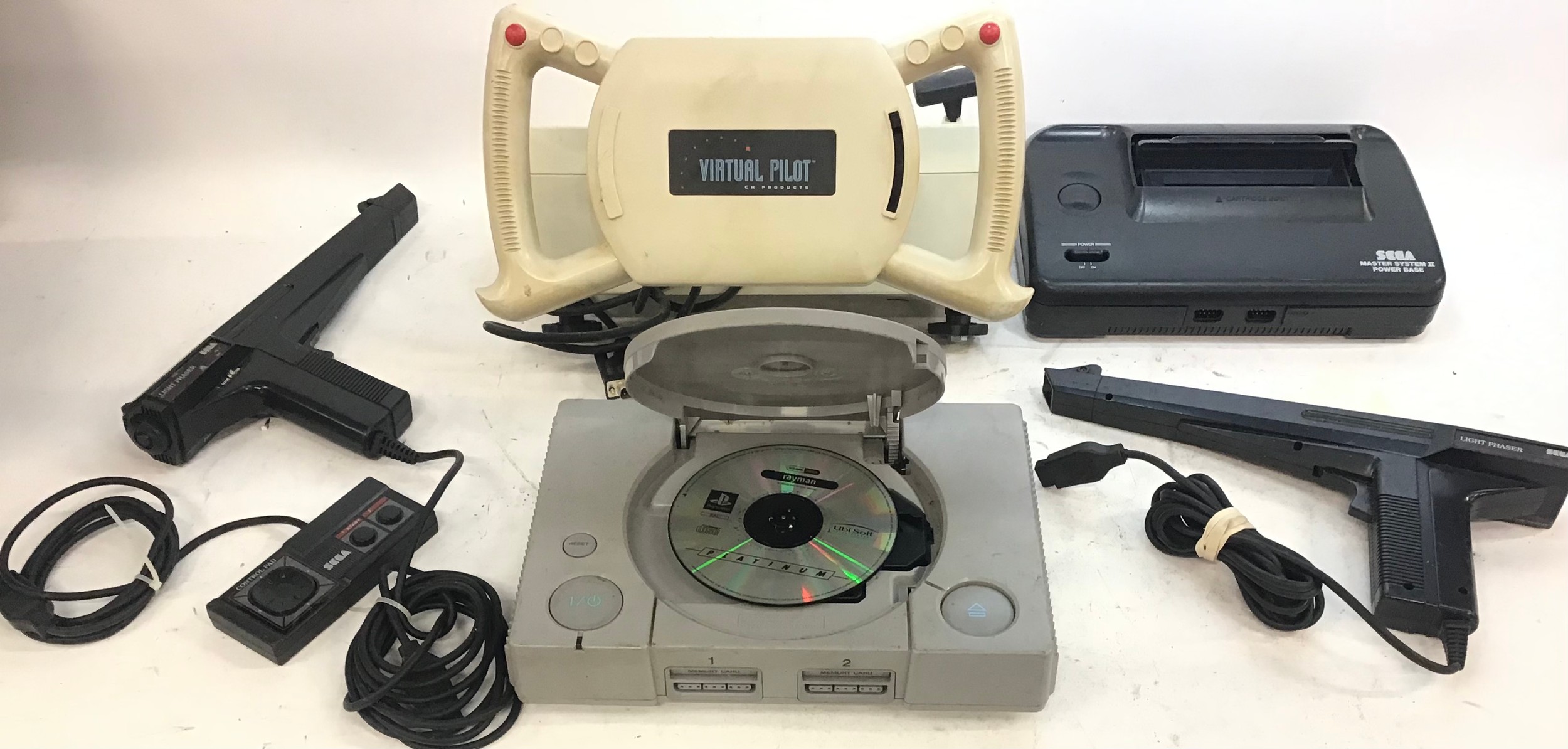 Gamers lot to include a Virtual Pilot Simulator Yoke / joystick, Sega Master System with 2 light