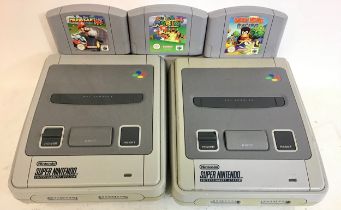 Super Nintendo Entertainment Systems x 2 complete with Mario Kart 64 - Super Mario 64 and Daddy Kong