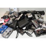 A large crate of modern 35mm compact cameras including leading brands