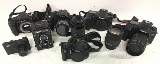 Collection of various cameras and lenses from the makes of Cannon - Lubitel - Sony - Finepix etc.