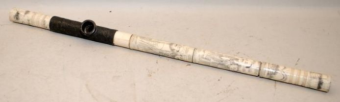 Antique carved bone opium pipe decorated with Oriental figures. O/all length 50cms