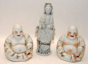A pair of Chinese porcelain blanc de chine Buddhas with gilt decoration (H14cm) and a figure of