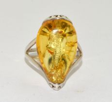 A new 925 silver and amber large adjustable dress ring. Size O +