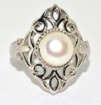 A 925 silver and pearl TGGC decorative ring Size U