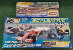 Scalextric Digital World Championship set together with a Scalextric Ultimate Track Extension