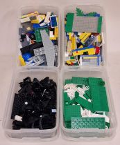 Collection of vintage loose Lego bricks spread among four tubs.