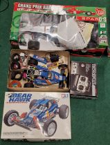 Vintage Tamiya Bear Hawk radio controlled car with boxed remote together with a Spar remote