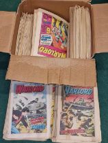 A box of vintage 1980's Warlord comics.