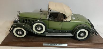 Cadillac Roadster convertible V-16 model car on wooden plinth.