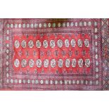 A red ground wool Bokharra rug, 128 x 196cm