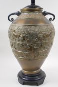 A Chinese brass two handled vase with archaic style kylin decoration, converted to a lamp, 50cm high