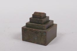A nest of four Chinese bronze seals, 4 x 4cm