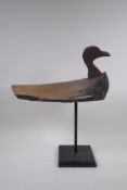 A vintage style decoy duck mounted on a display stand, 47cm high, 37cm long
