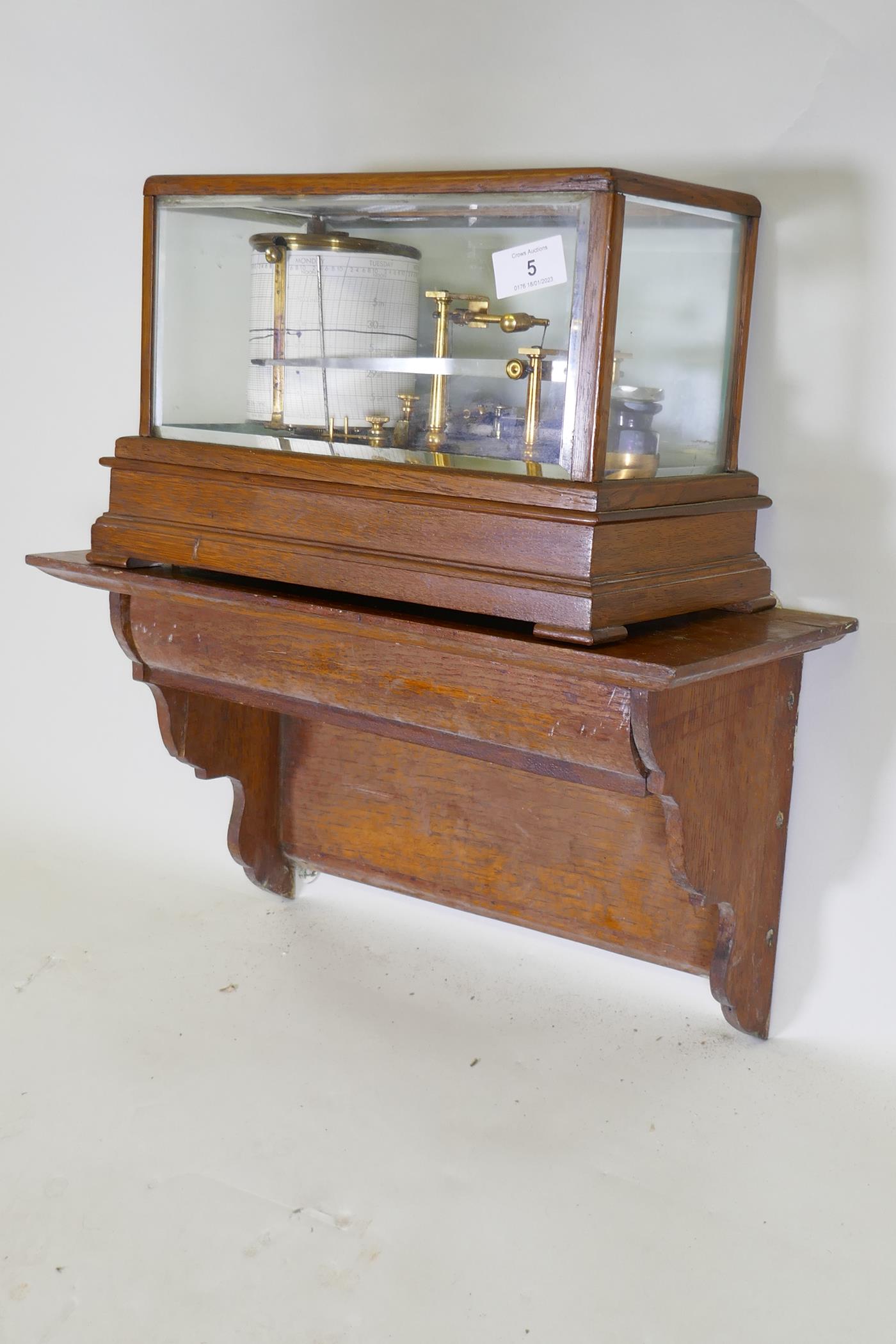 A brass barograph in a glazed oak case with wall bracket fitted with a drawer, glass cracked, drawer - Image 3 of 7