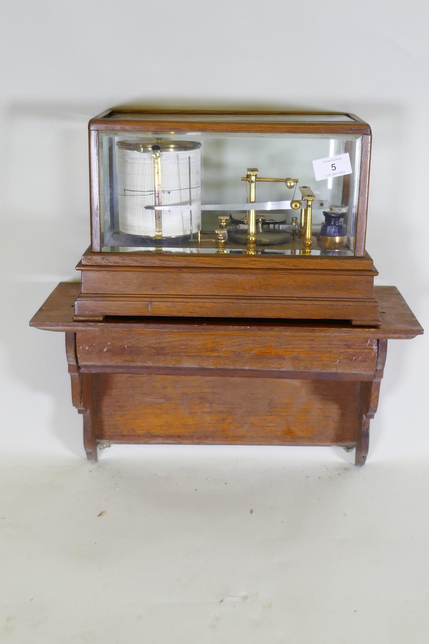 A brass barograph in a glazed oak case with wall bracket fitted with a drawer, glass cracked, drawer - Image 2 of 7
