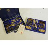 A Solingen 23k gold plated 12 place cutlery service in leatherette case, appears unused