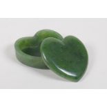 A carved spinach jade heart shaped box and cover, 5 x 5cms